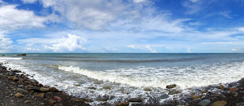 Panoramic view of the rugged coastline with rocks and surf in southern Taiwan