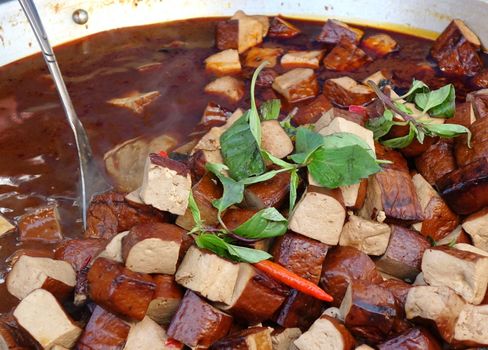 Pressed bean curd with chilies and fresh basil