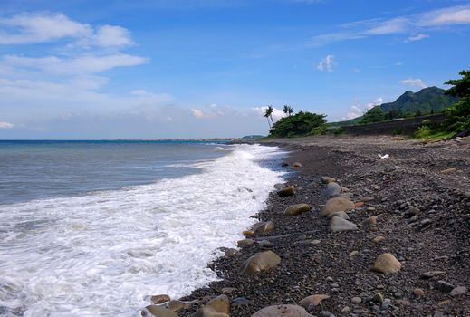 Rugged coastline with rocks and surf in southern Taiwan
