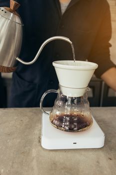 Barista brewing coffee, method pour over, drip coffee