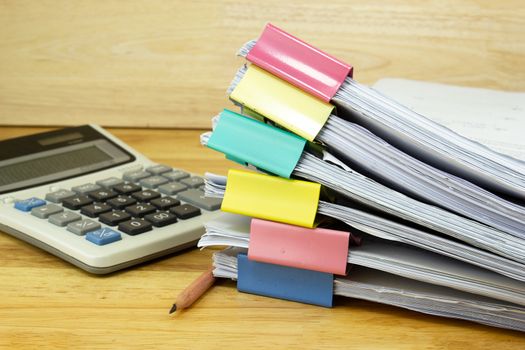 file folder and Stack of business report paper file with 

Calculator on the table in a work office, concept document in work office