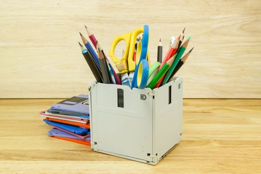 recycle floppy disk, Creative objects used for Store supplies such as pen pencils Scissors in a box on the table in work office, concept recycle floppy disk 