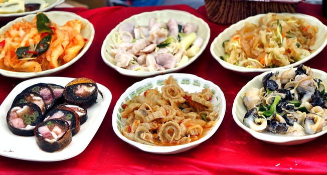 A stall at a local night market in Taiwan sells seafood dishes
