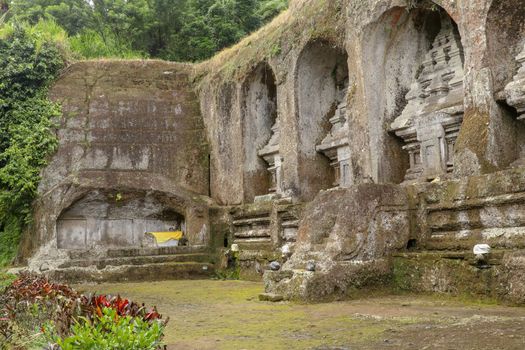 Ganung Kawi Temple complex centered around Royal Tombs carved into stone cliffs in the 11th century. Bali, Indonesia. Funeral temple complex centered around royal tombs carved into stone cliffs.