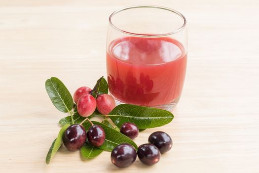 fresh Carissa carandas glass of juice with Carissa carandas fruits and Healthy drinks concept
