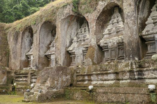 Ganung Kawi Temple complex centered around Royal Tombs carved into stone cliffs in the 11th century. Bali, Indonesia. Funeral temple complex centered around royal tombs carved into stone cliffs.