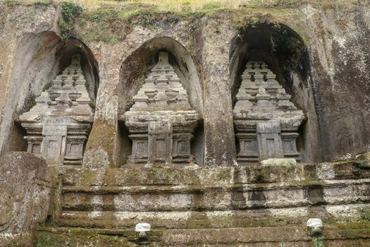 Udayana Dynasty Royal Tombs. Ancient royal tombs at Gunung Kawi Temple. Funeral complex centered around royal tombs carved into stone cliffs in the 11th century. Bali, Indonesia.