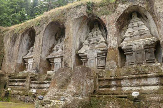 Udayana Dynasty Royal Tombs. Ancient royal tombs at Gunung Kawi Temple. Funeral complex centered around royal tombs carved into stone cliffs in the 11th century. Bali, Indonesia.