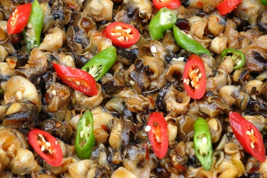 Fried sea snails with red and green hot chili