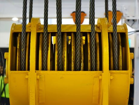 A large winch with rolled up steel cables