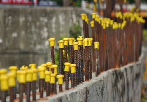 Rebar steel rods with yellow end protection caps