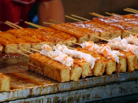 Stinky fermented tofu with pickled cabbage and hot sauce is popular in Taiwan