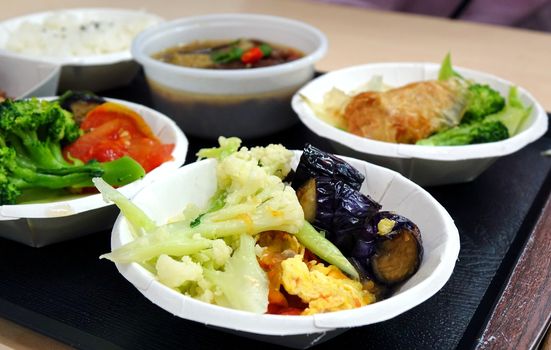 A Chinese lunch set with beef stew and assorted vegetables