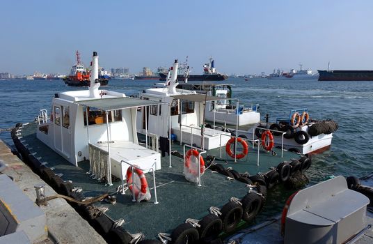 Small pilot boats are anchored at Kaohsiung Harbor