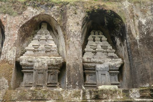 Udayana Dynasty Royal Tombs. Ancient royal tombs at Gunung Kawi Temple. Funeral complex centered around royal tombs carved into stone cliffs in the 11th century. Bali, Indonesia.
