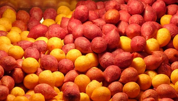 Sweet potato balls in red and yellow, a popular street food in Taiwan
