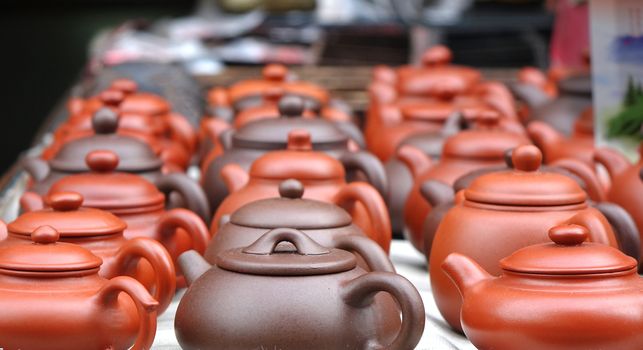 A market stall sells Chinese ceramic teapots
