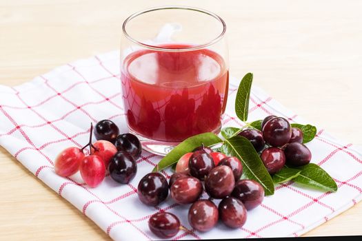 fresh Carissa carandas glass of juice with Carissa carandas fruits and Healthy drinks concept
