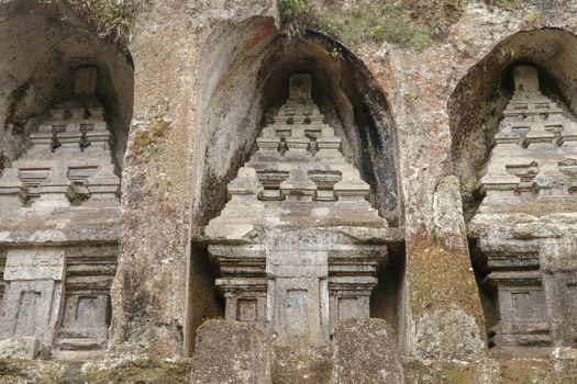 Udayana Dynasty Royal Tombs. Ancient royal tombs at Gunung Kawi Temple. Funeral complex centered around royal tombs carved into stone cliffs in the 11th century. Bali, Indonesia.
