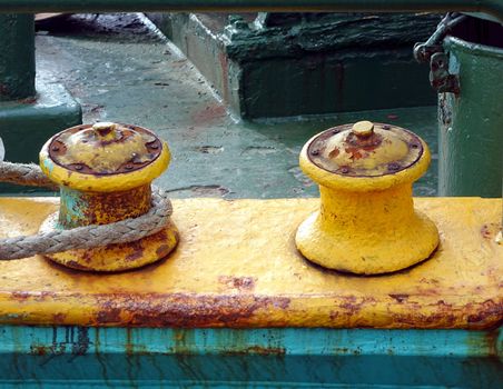 Two old mooring posts with a thick rope wrapped around it