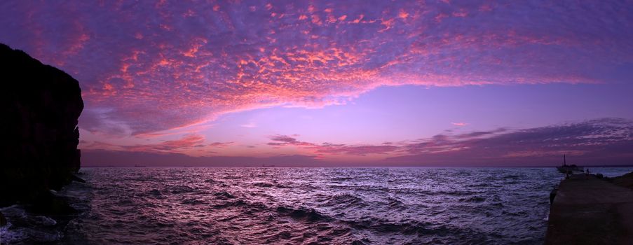 Dramatic ocean scenics with purple sky just after sunset
