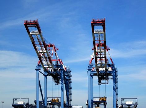 Large cranes used for loading containers on to ships