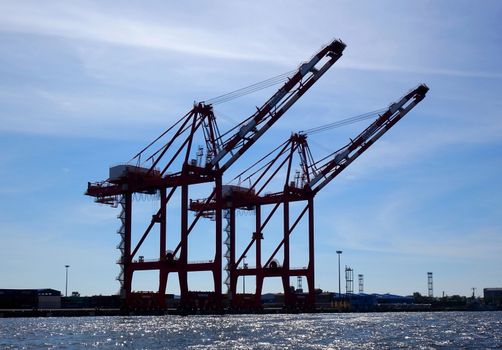 Two large cranes used for loading containers on to ships