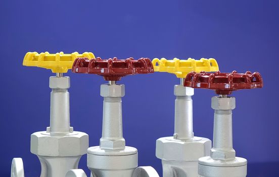 Red and yellow hand wheels for industrial valves
