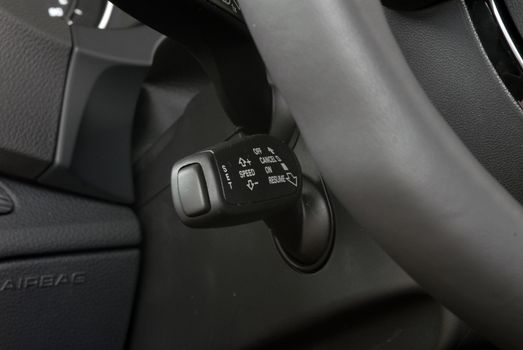 cruise control stick which is located behind the wheel