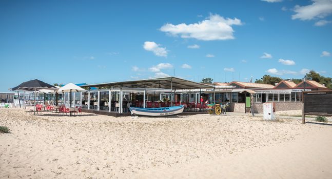 Tavira Island, Portugal - May 3, 2018: Tourist restaurant terrace on the island of Tavira in the beach town center on a spring day