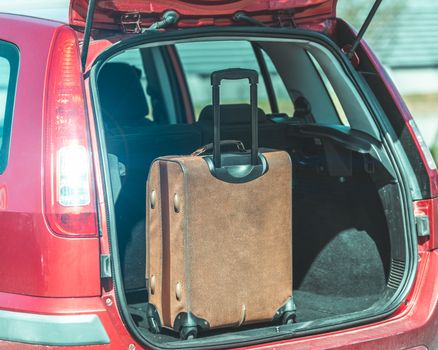 luggage in the trunk of a passenger car.