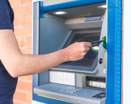 Withdraw cash from an ATM using a credit card.