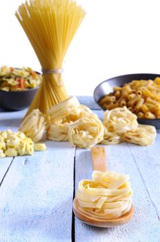 Pasta in a wooden table on kitchen.