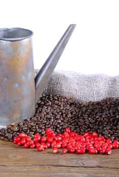 Coffee beans on a wooden table and white background