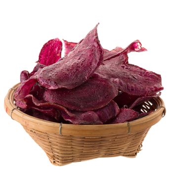 purple potatoes Sliced and fried crisps In the basket isolated on white background.