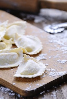 Preparing fresh ravioli at the kitchen table.