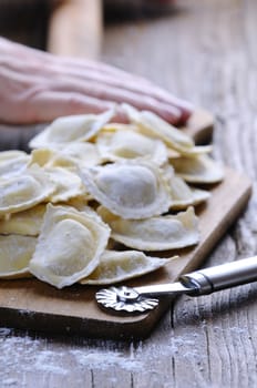 Preparing fresh ravioli at the kitchen table.