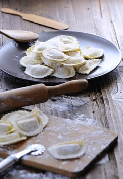 Preparing fresh ravioli at the kitchen table.