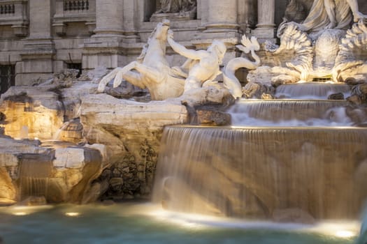 Detail of Trevi fountain in Rome, iluminated by night.