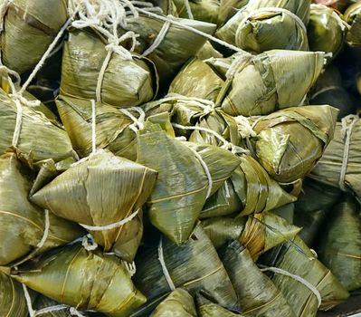 Chinese sticky rice dumplings (Zongzi) wrapped in leaves