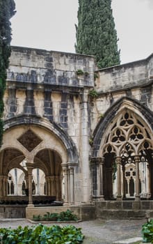 Detail of the cloister of Santa Maria de Poblet Monastery, Unesco heritage. Romanesque cloister architecture in Poblet, Spain.