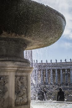 Fountain in St.Peter square with the Bernini's colonnade in the background. Rome Italy