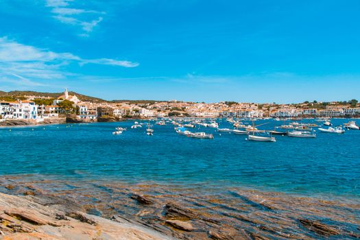 Sea landscape with Cadaques, Catalonia, Spain near of Barcelona. Scenic old town with nice beach and clear blue water in bay. Famous tourist destination in Costa Brava with Salvador Dali landmark