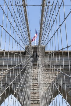 Brooklyn Bridge with USA flag. New york Cty