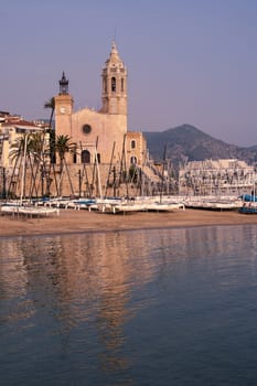 St. Bartholomew and Santa Tecla's church and the mediterranean sea in Sitges, Spain