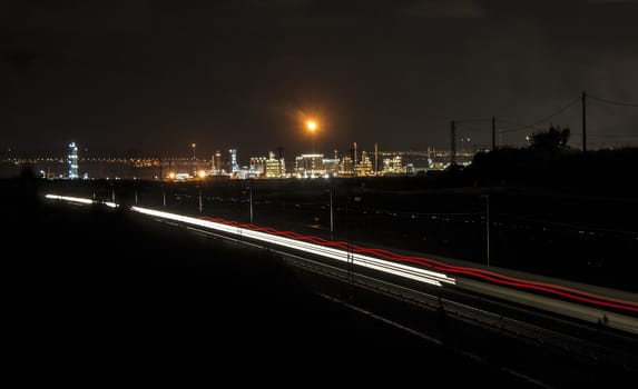 Factory Smoke stack. Petrochemical plant, Oil and gas refinery with trai lighttrails