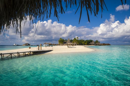 a Maldives tropical island and turquoise water. Suitable for an idea of vacations, Caribbean or tropical summer time.
