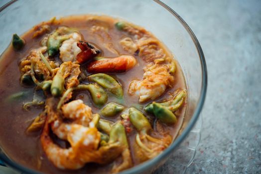 Hot and Sour Katuri Flower Soup for sale at Thai street food market or restaurant in Thailand