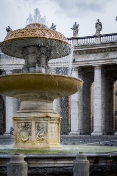 Fountain in St.Peter square with the Bernini's colonnade in the background. Rome Italy