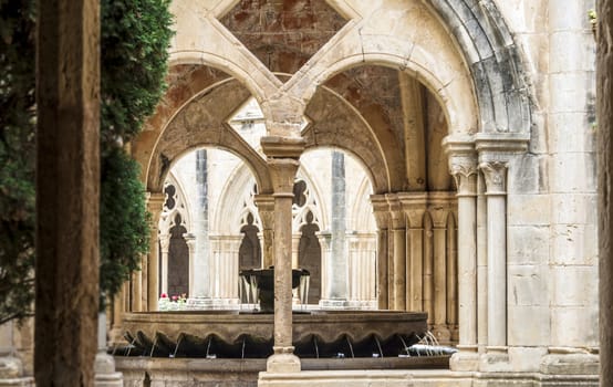 Detail of the cloister of Santa Maria de Poblet Monastery, Unesco heritage. Romanesque cloister architecture in Poblet, Spain.